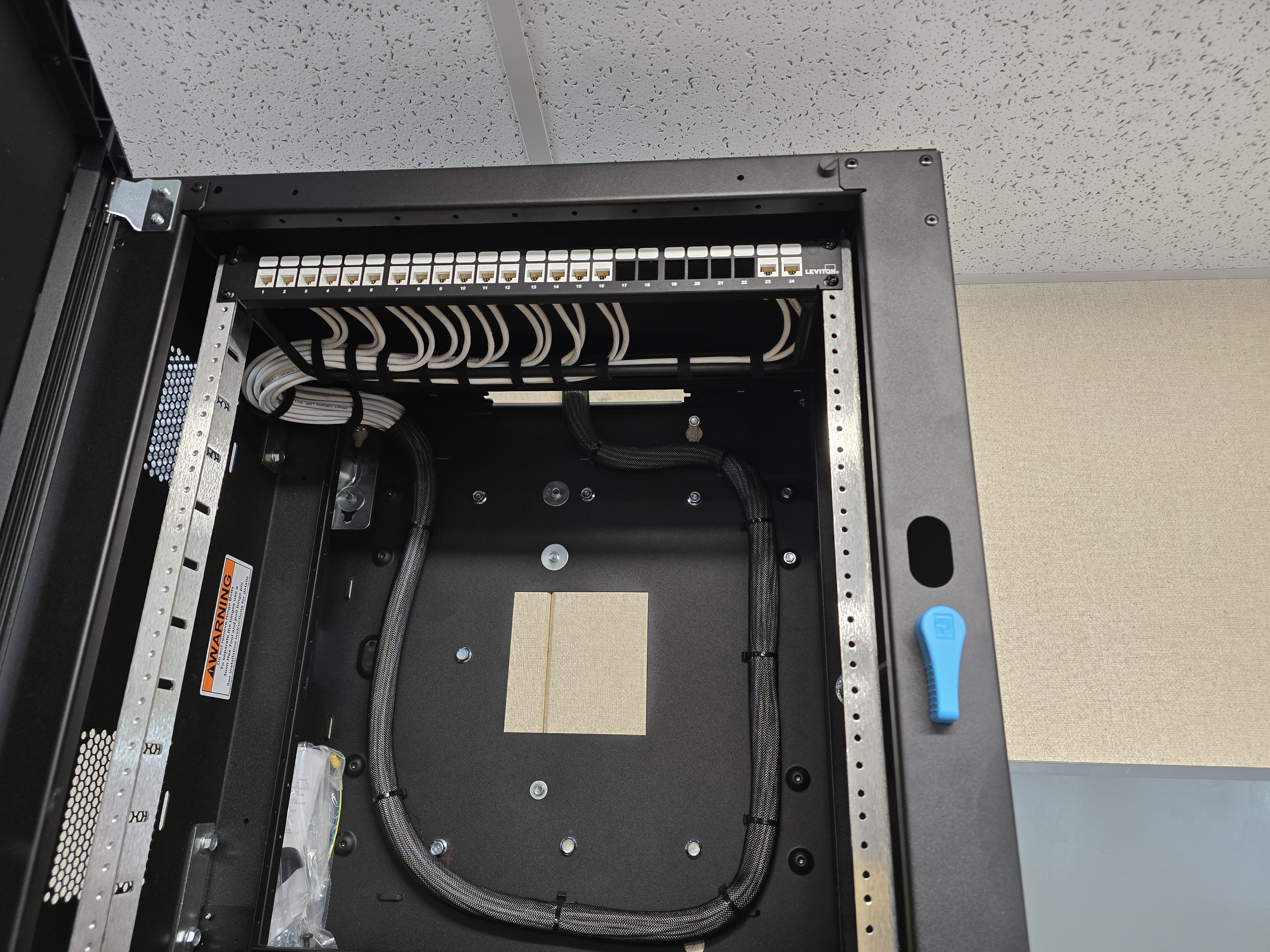 Clean commercial network rack and Cat6 cabling installed by Trinity Systems
